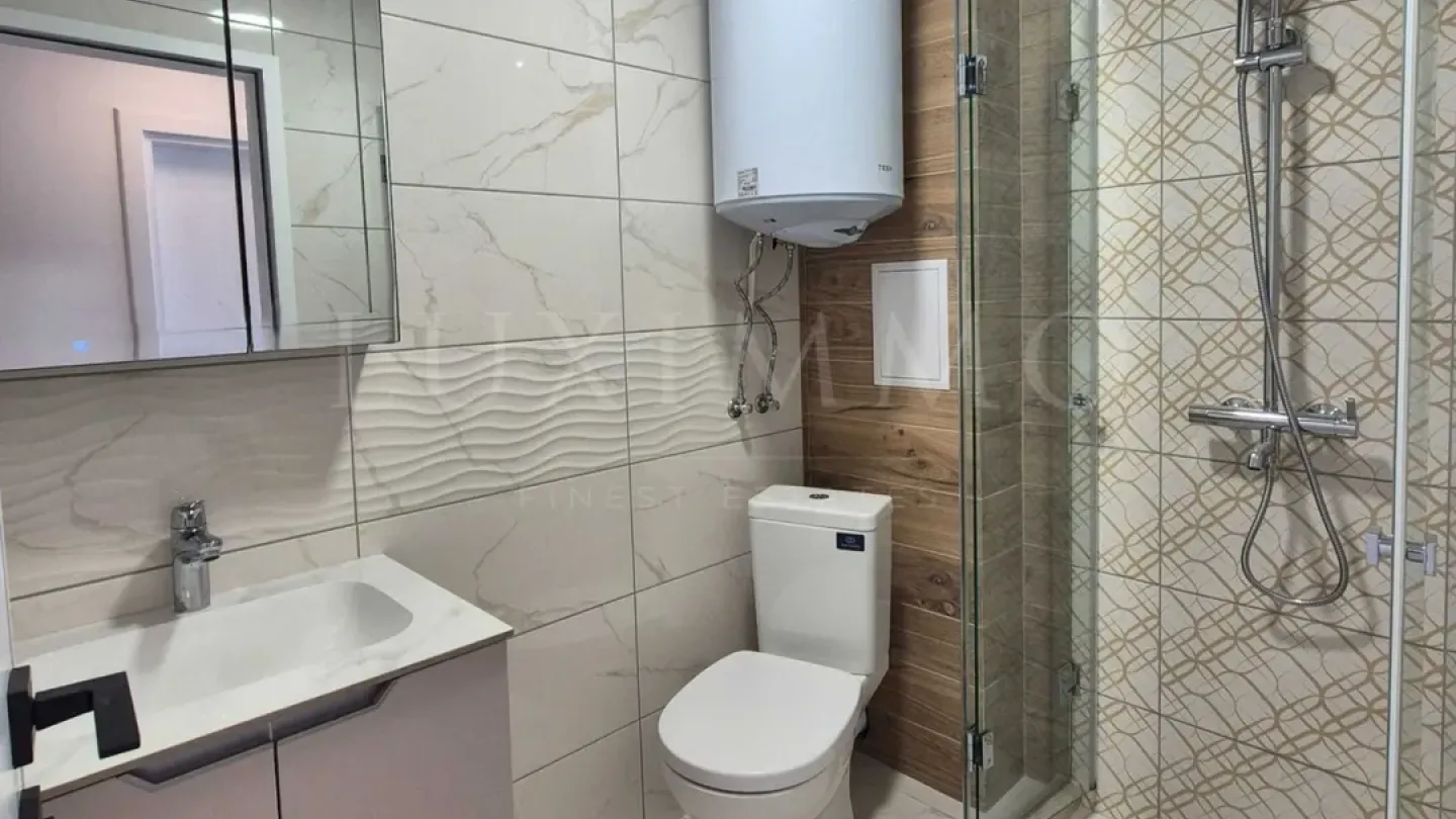Stylish One-Bedroom Apartment with Private Landscaped Yard in Pchelina - Image 1