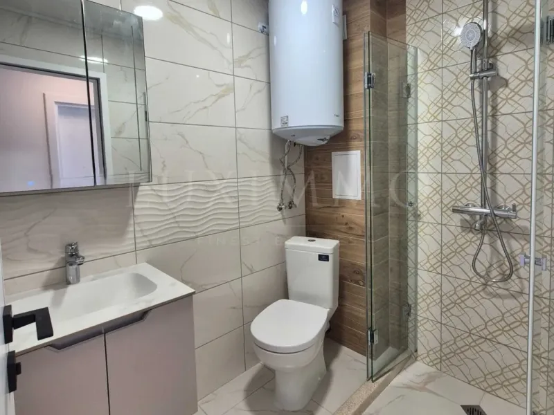 Stylish One-Bedroom Apartment with Private Landscaped Yard in Pchelina - Image 1